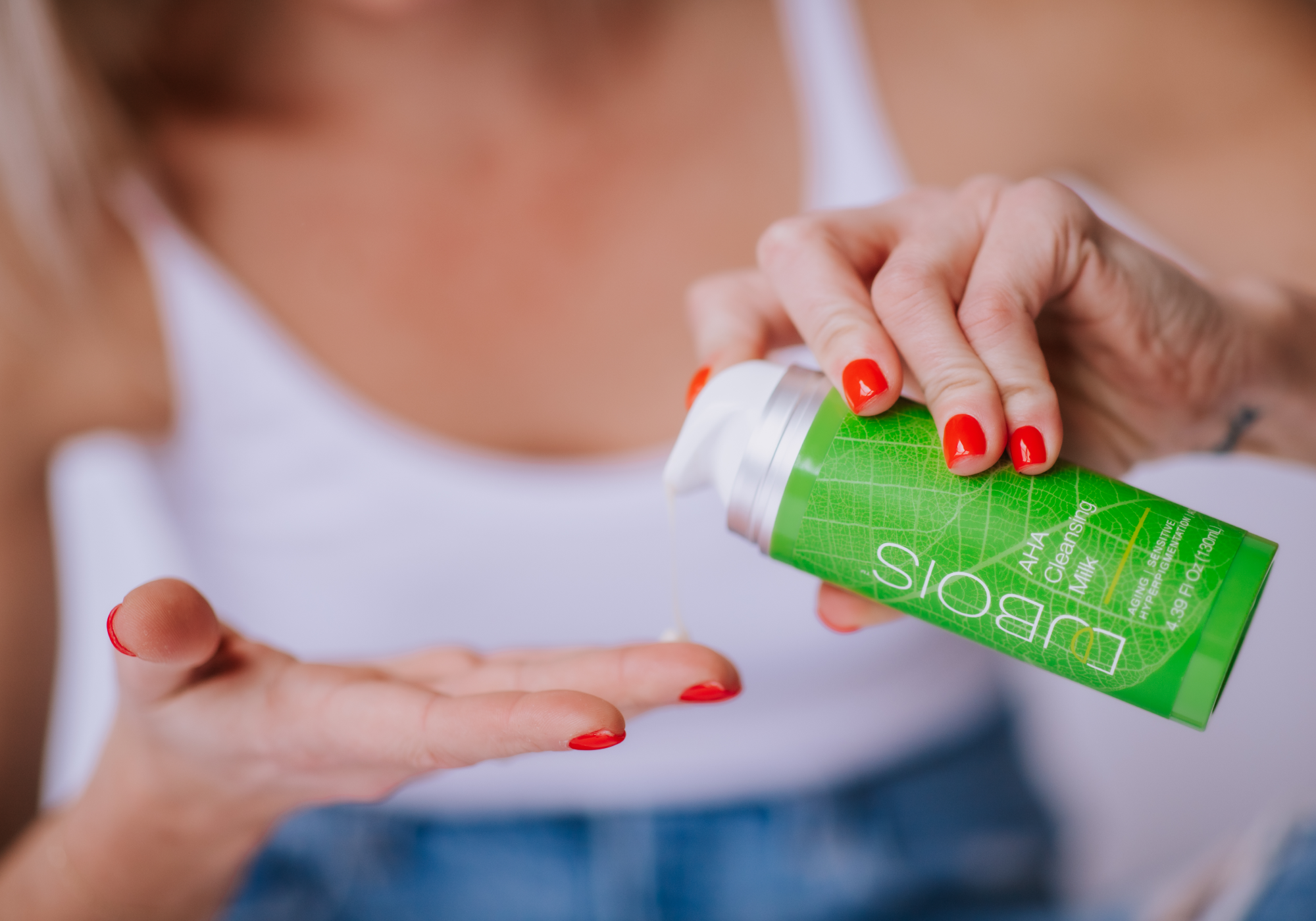 woman dispensing a cleanser
