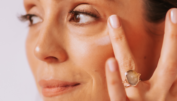 woman applying eye cream