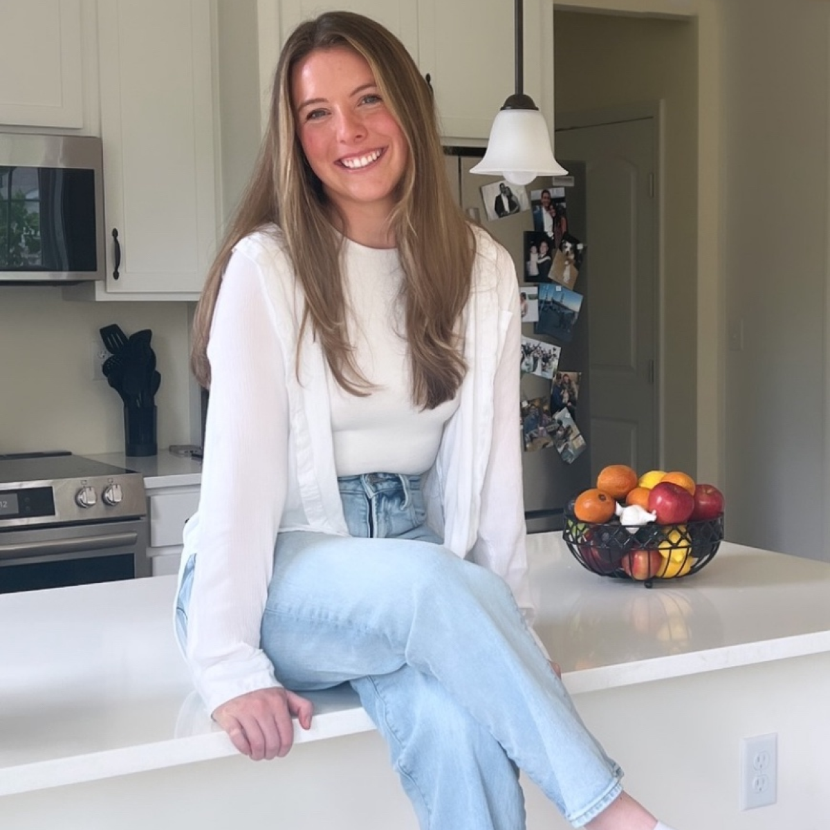 woman sitting on a kitchen counter