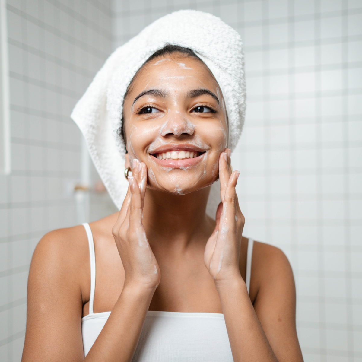 tween girl washing face