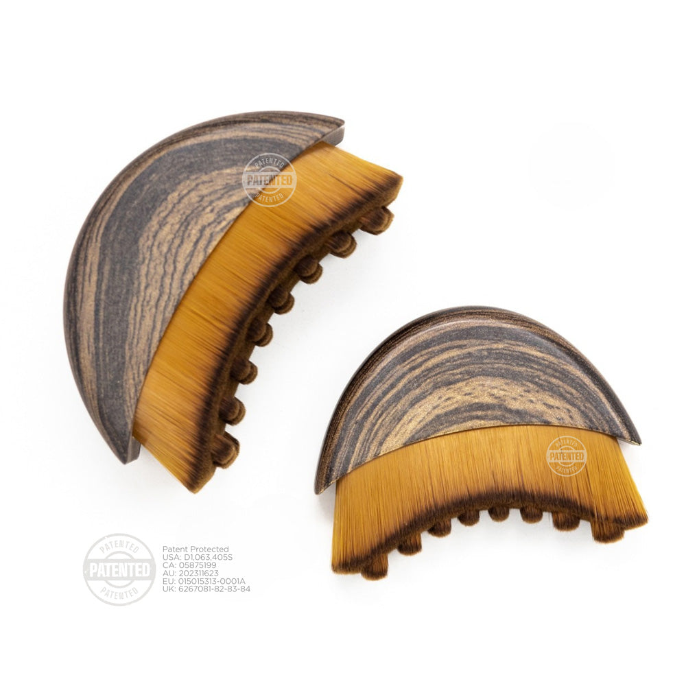 Two wooden lymphatic brushes with brown bristles on a white background