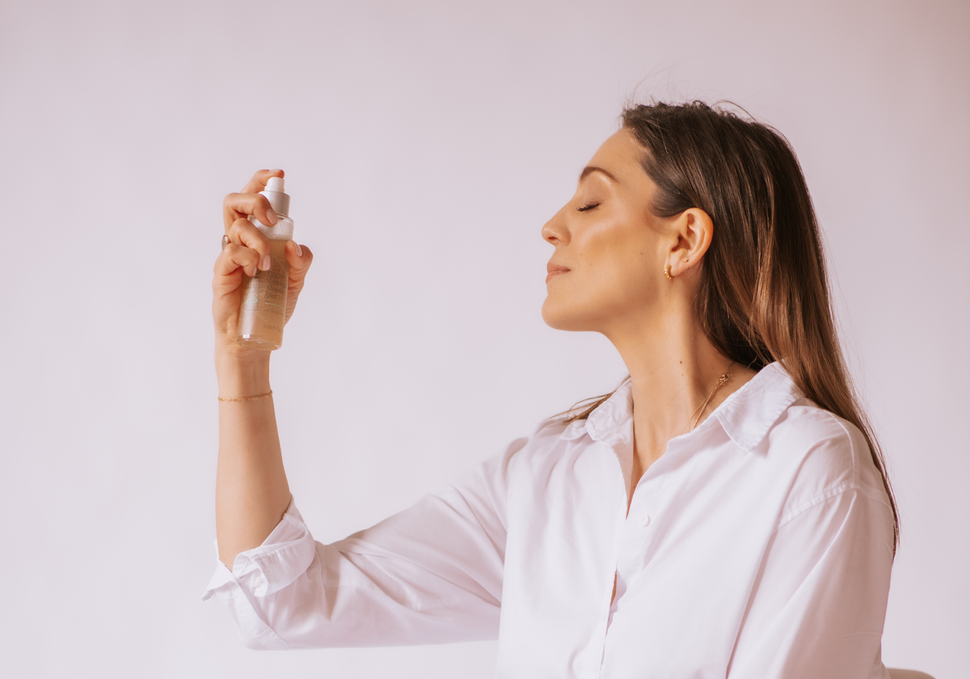 woman misting face