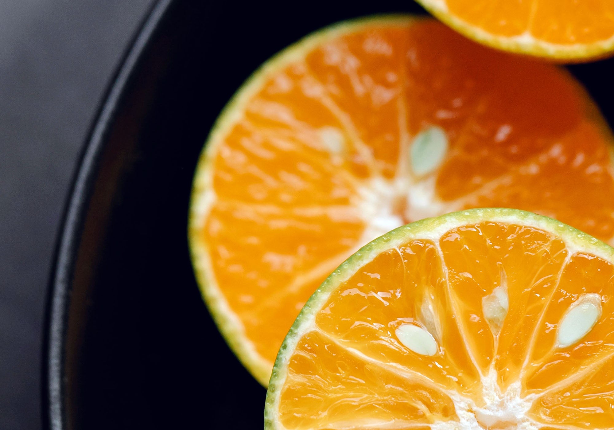 Three slices of orange on a plate