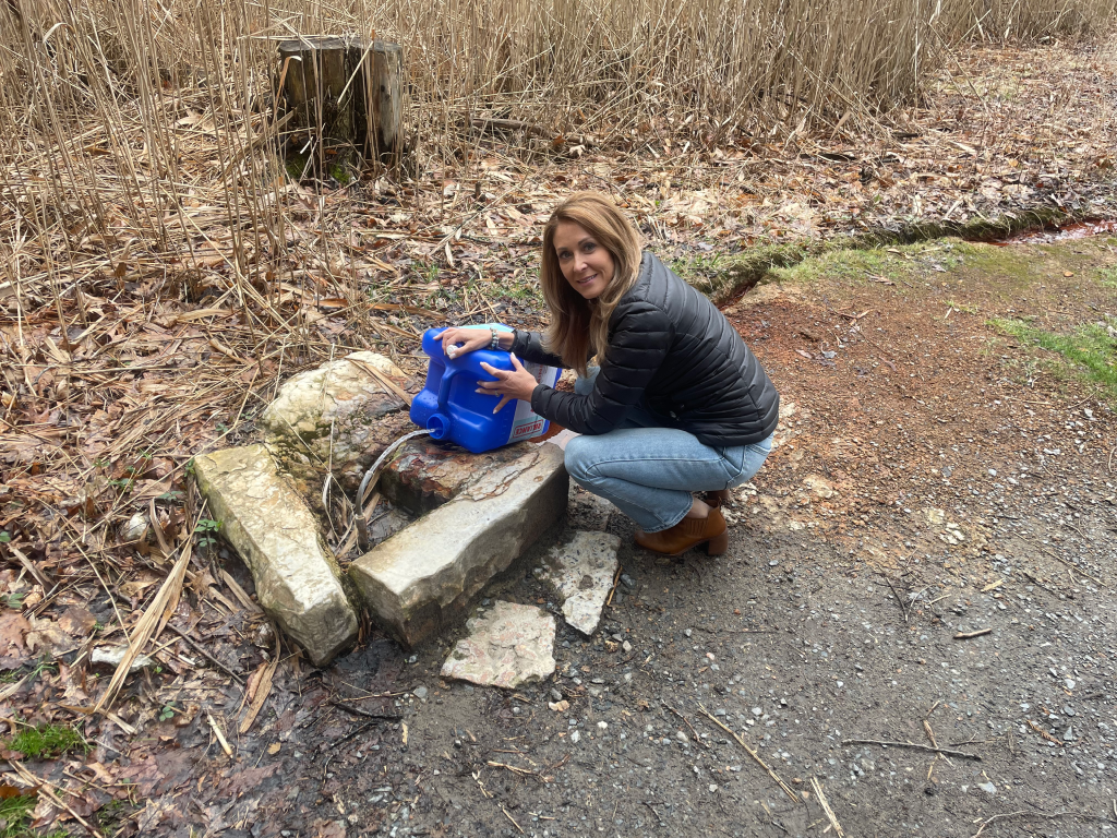 denise dubois at saratoga springs collecting water from the springs